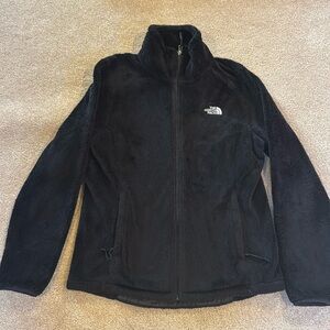 Women’s fleece North Face zip up jacket.